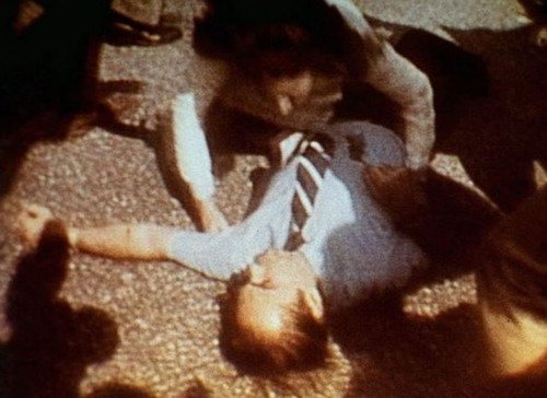 George Wallace lies wounded on the ground after being shot four times